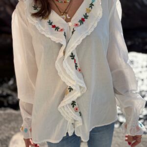 Blusa con rouches ricamata